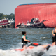 Emergency responders work to rescue crew members from a capsized cargo ship on September 9, 2019 in St Simons Island, Georgia. A 656-foot vehicle carrier, the M/V Golden Ray departed the Brunswick port on Sunday and suffered a fire on board, capsizing in St. Simons Sound